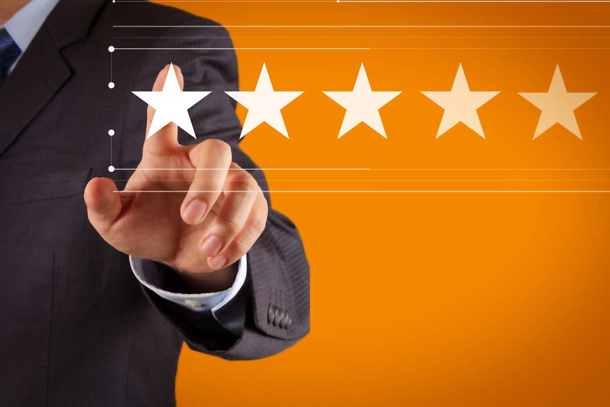 Five stars (5) rating with a businessman is touching virtual computer screen (R) (S)