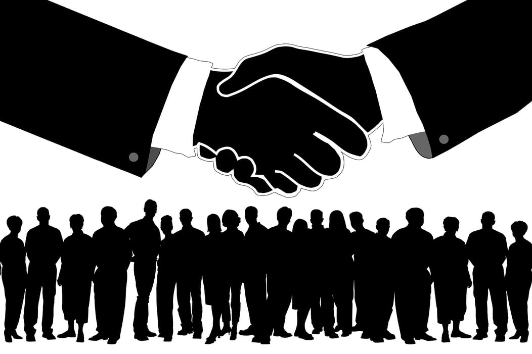 handshake with group of businessmen on the background